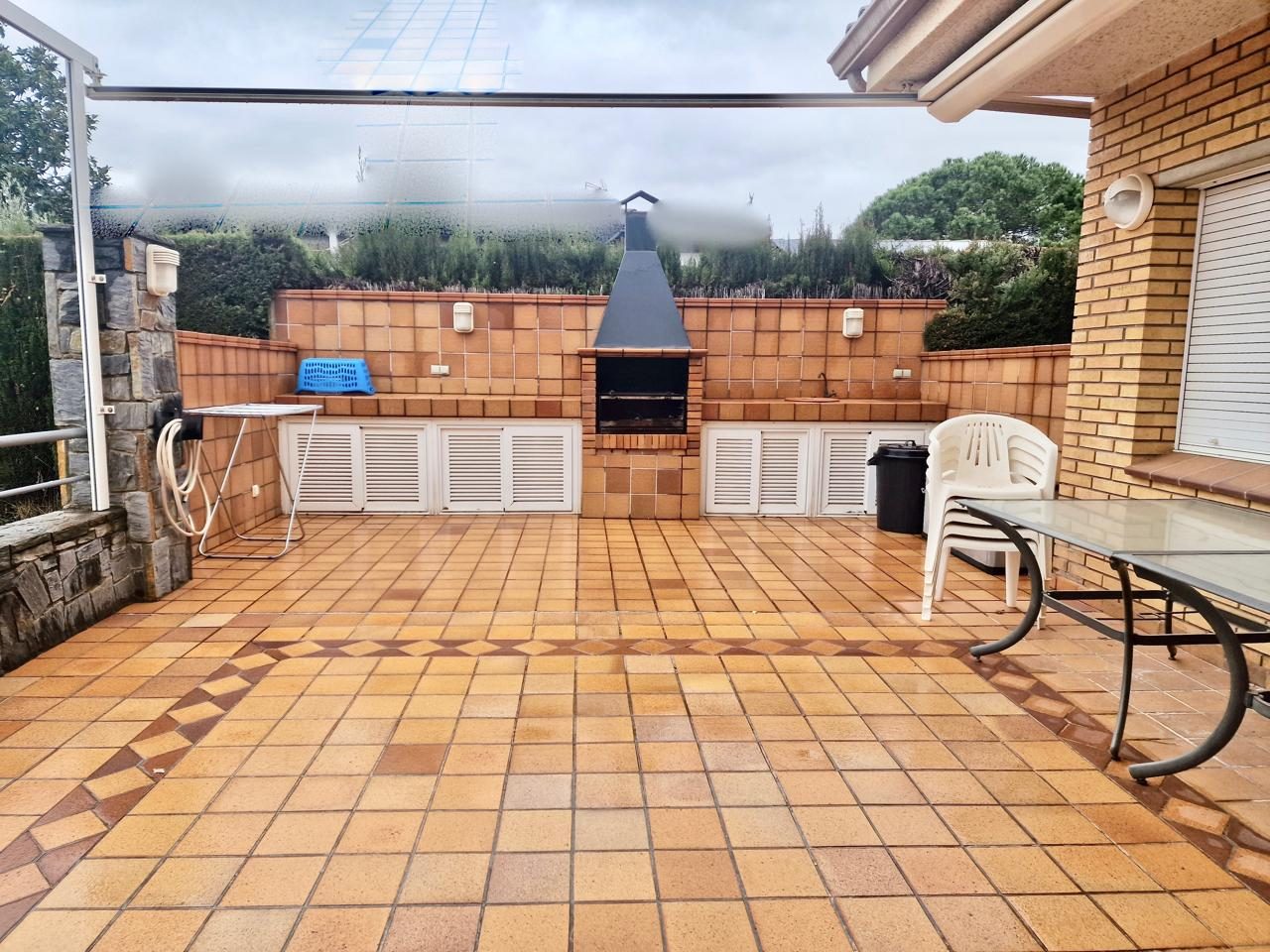 A 5-bedroom apartment block with a 4-car garage and a swimming pool